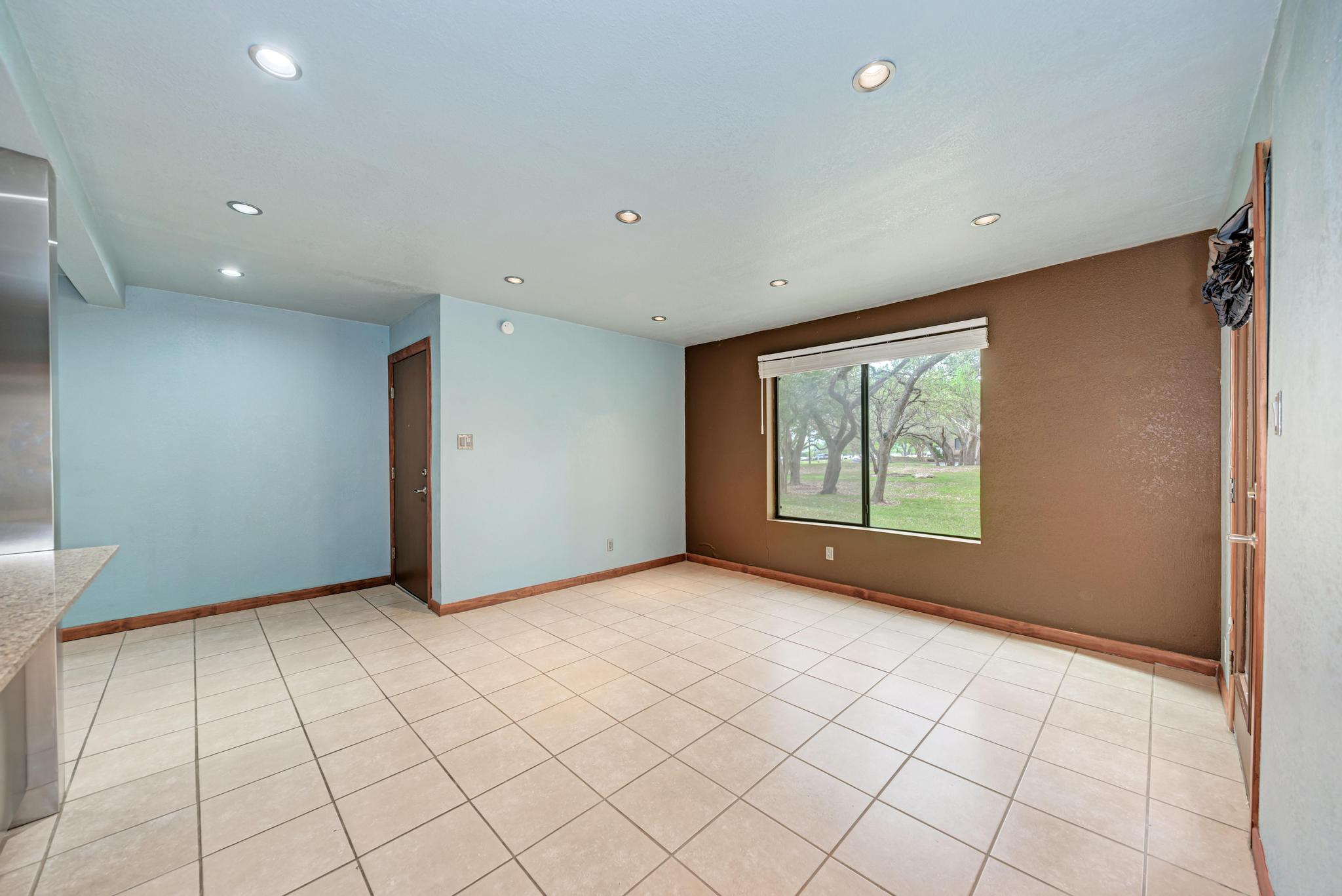 8210 Bent Tree Road, Unit 138 Austin, TX 78759 - Photo 11 of 23 Spare room with recessed lighting and light tile patterned floors