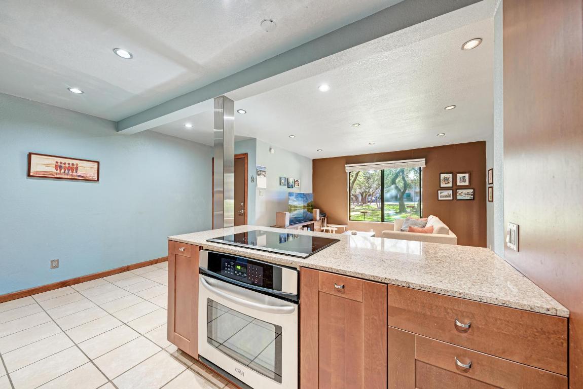 8210 Bent Tree Road, Unit 138 Austin, TX 78759 - Photo 24 of 24 a kitchen with a sink and cabinets