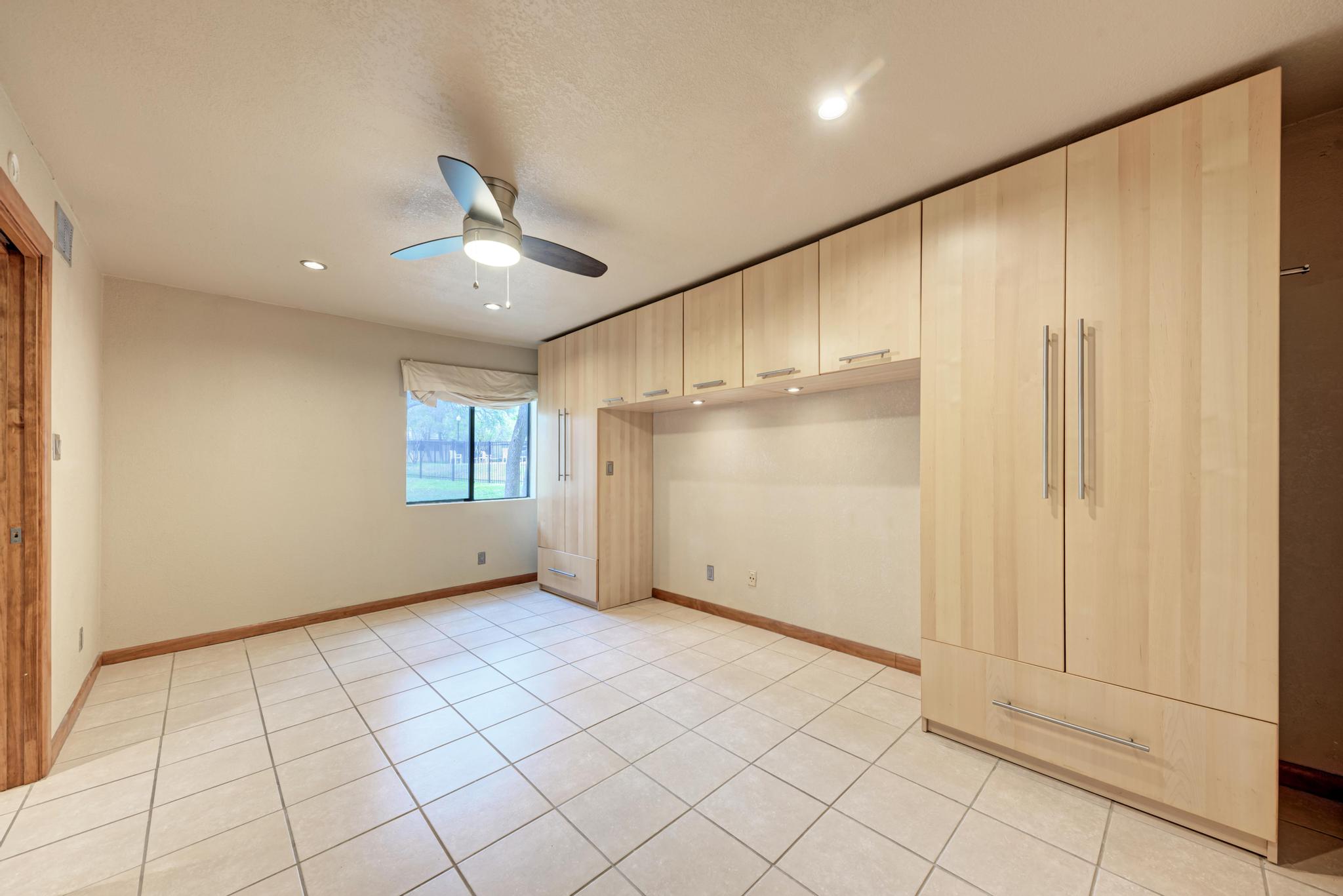 8210 Bent Tree Road, Unit 138 Austin, TX 78759 - Photo 19 of 23 Unfurnished bedroom featuring recessed lighting, ceiling fan, and light tile patterned floors