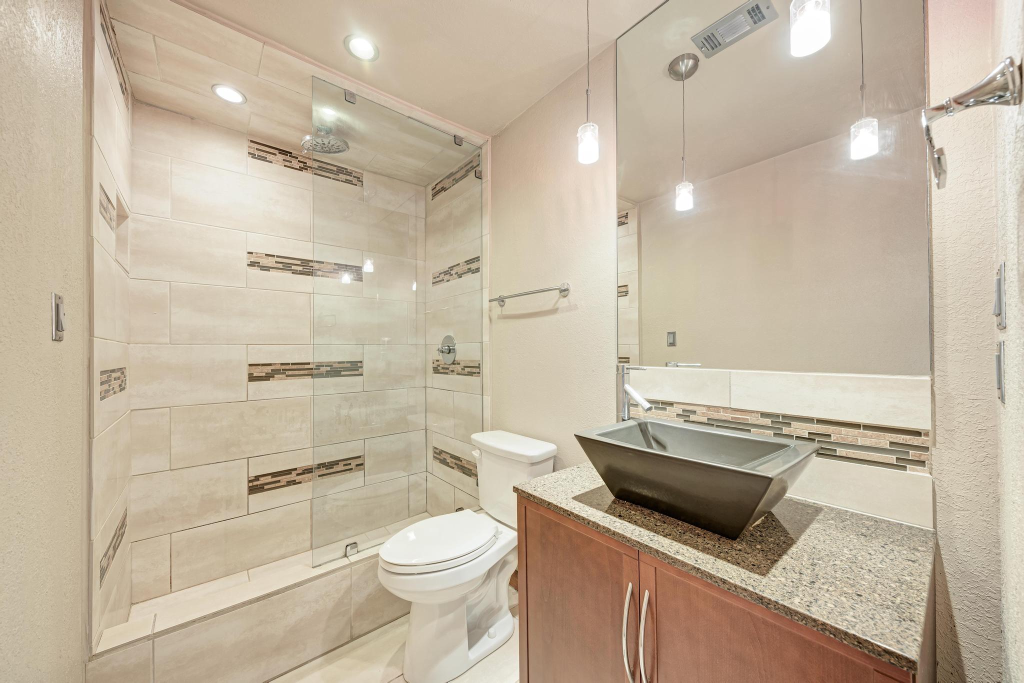 8210 Bent Tree Road, Unit 138 Austin, TX 78759 - Photo 21 of 23 Bathroom with vanity, a stall shower, and recessed lighting