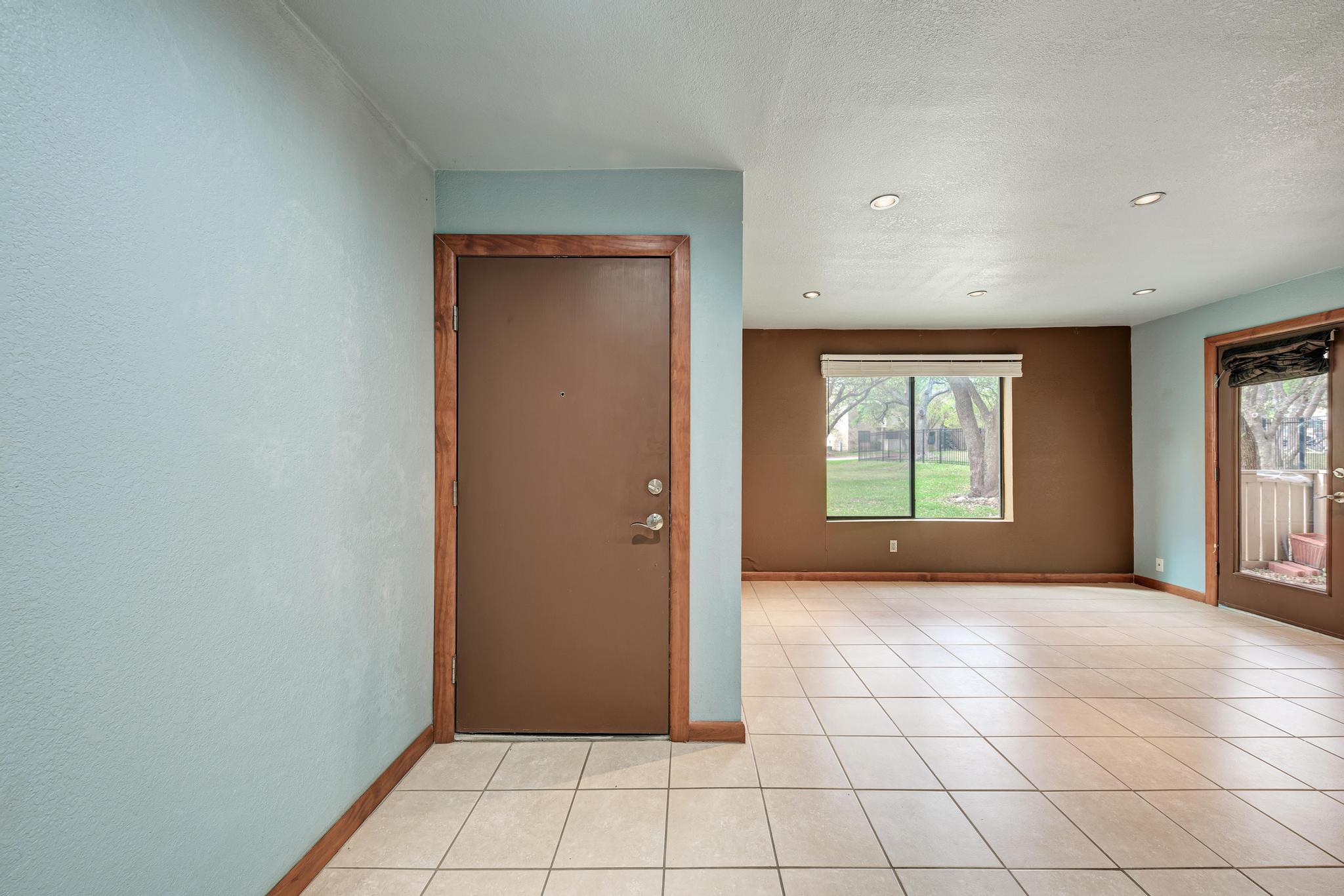 8210 Bent Tree Road, Unit 138 Austin, TX 78759 - Photo 9 of 23 Spare room with recessed lighting, a textured ceiling, and light tile patterned floors