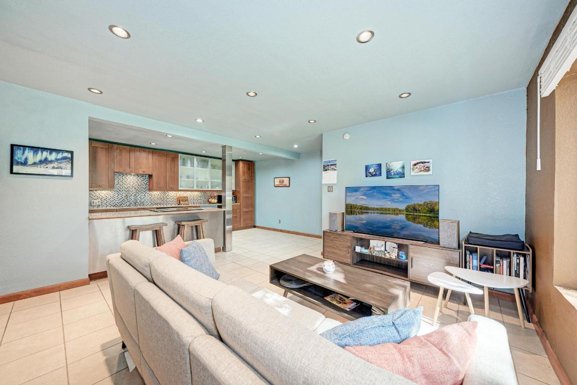 8210 Bent Tree Road, Unit 138 Austin, TX 78759 - Photo 9 of 24 a living room with furniture and a flat screen tv
