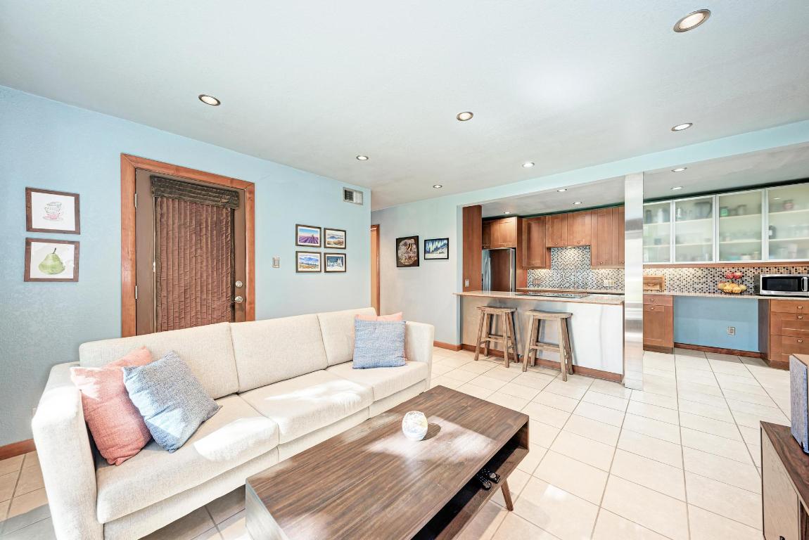 8210 Bent Tree Road, Unit 138 Austin, TX 78759 - Photo 10 of 24 a living room with furniture and a large window