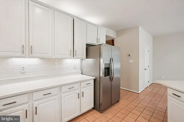 a bathroom with a tub a sink and window