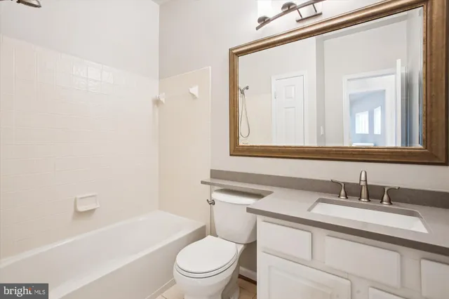a kitchen with granite countertop a sink and cabinets