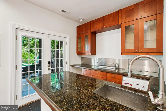 a view of a deck with two chair and wooden floor