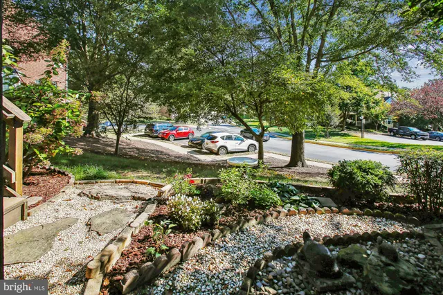 a picture of a bench in front of a wall