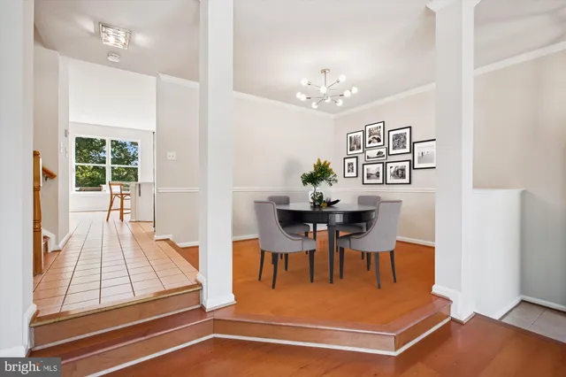 a open kitchen with granite countertop a stove a sink and a refrigerator