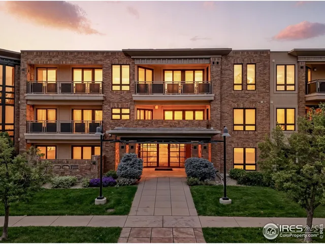 a front view of building with a garden