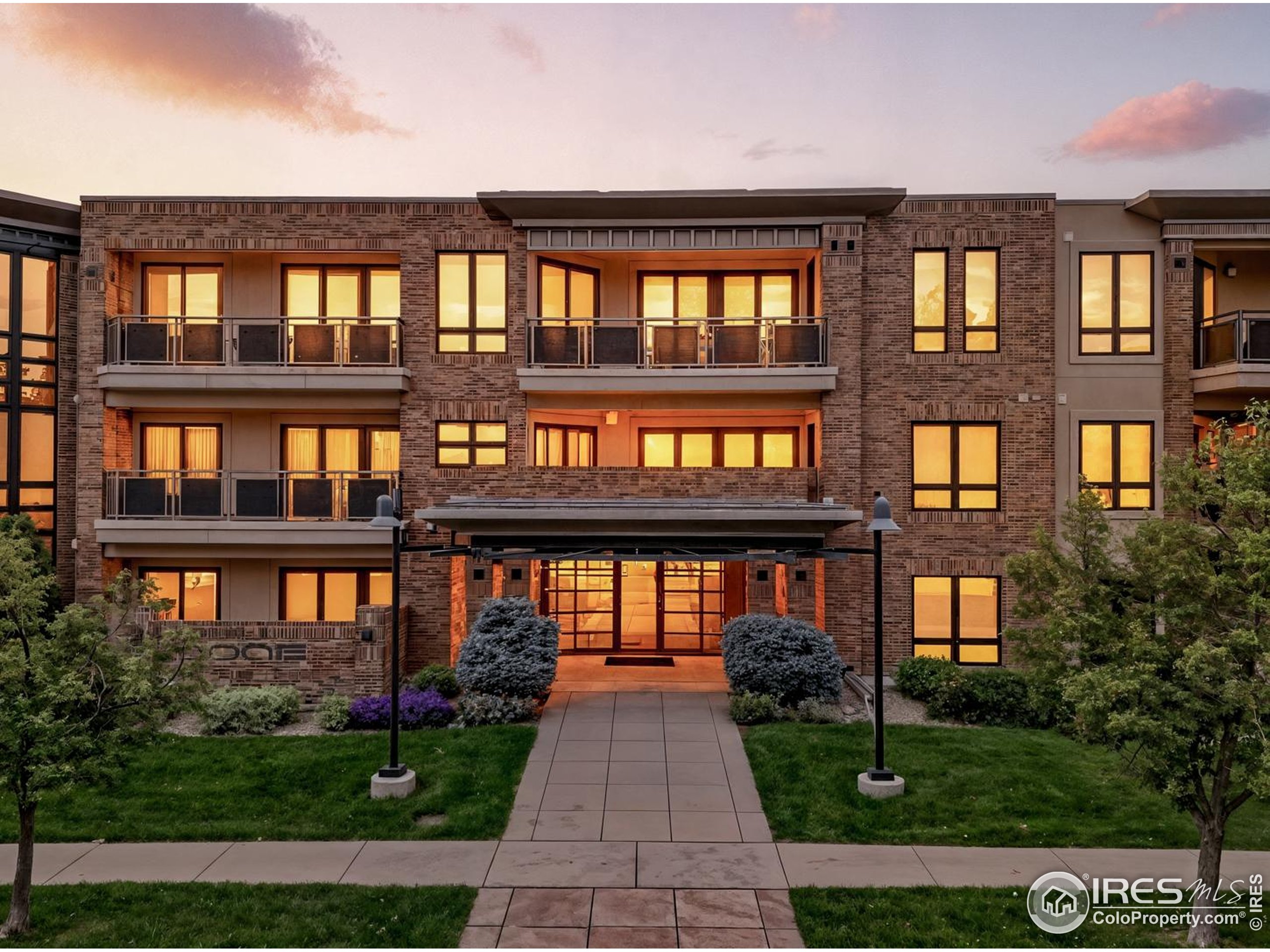 a front view of building with a garden