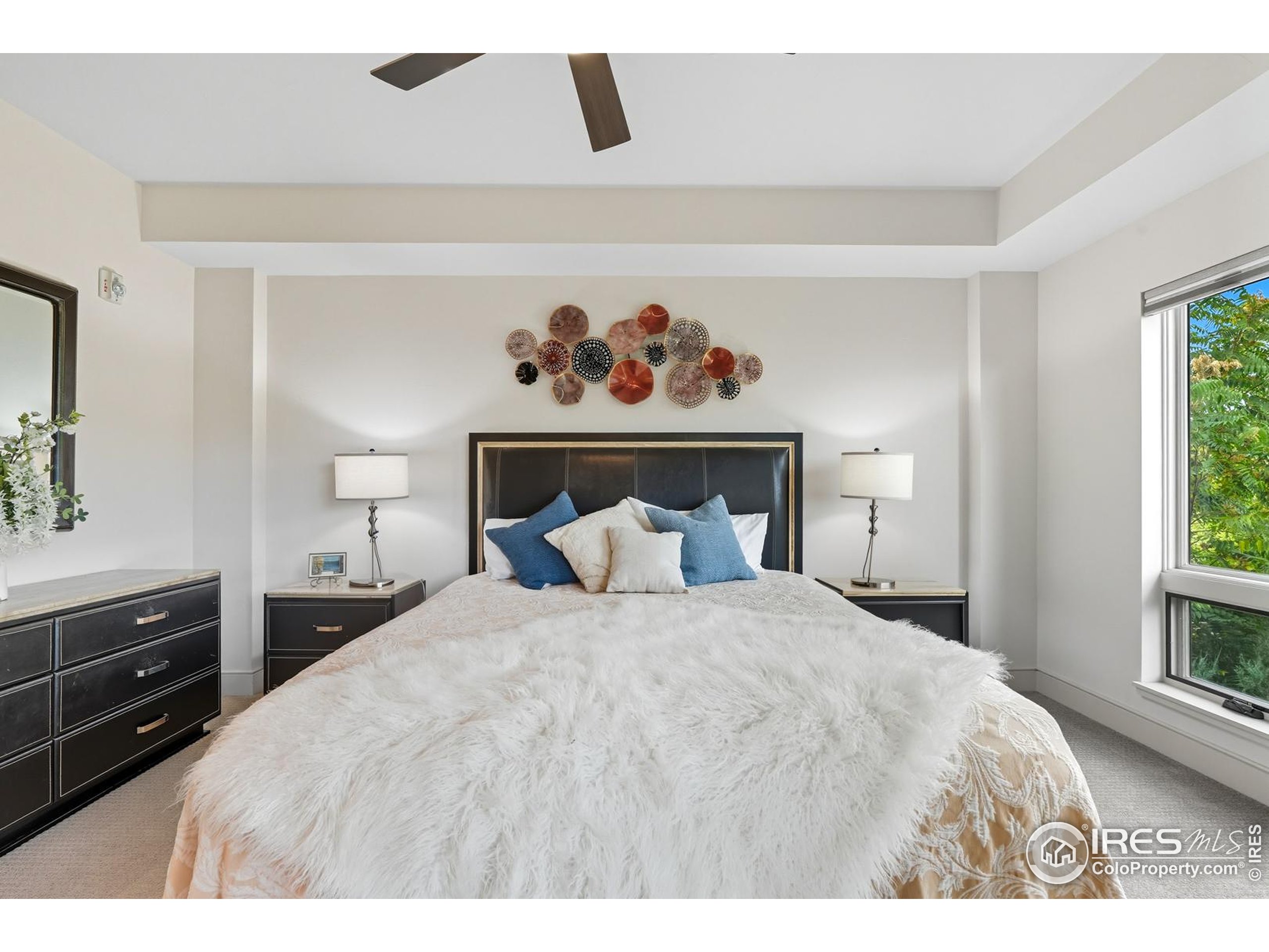 2801 Pennsylvania Avenue, Unit 203 Boulder, CO 80303 - Photo 15 of 50 a bedroom with a bed and a dresser