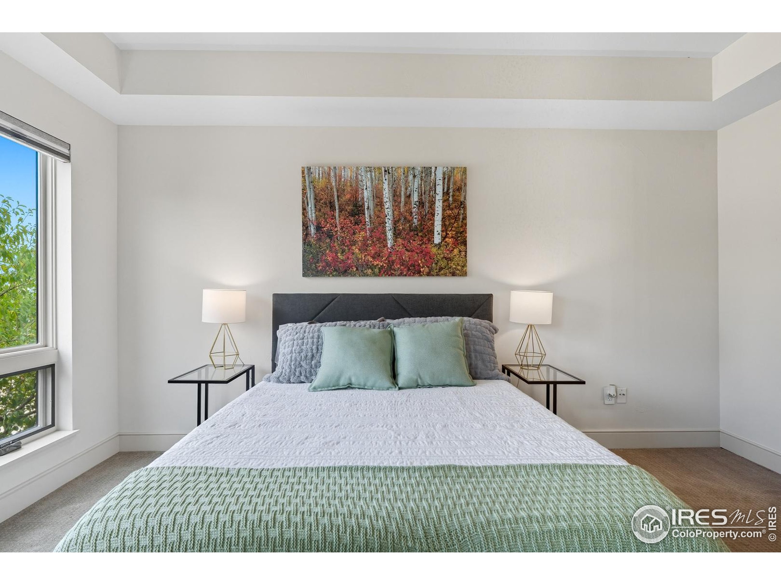 2801 Pennsylvania Avenue, Unit 203 Boulder, CO 80303 - Photo 19 of 50 a bedroom with a bed and a night stand