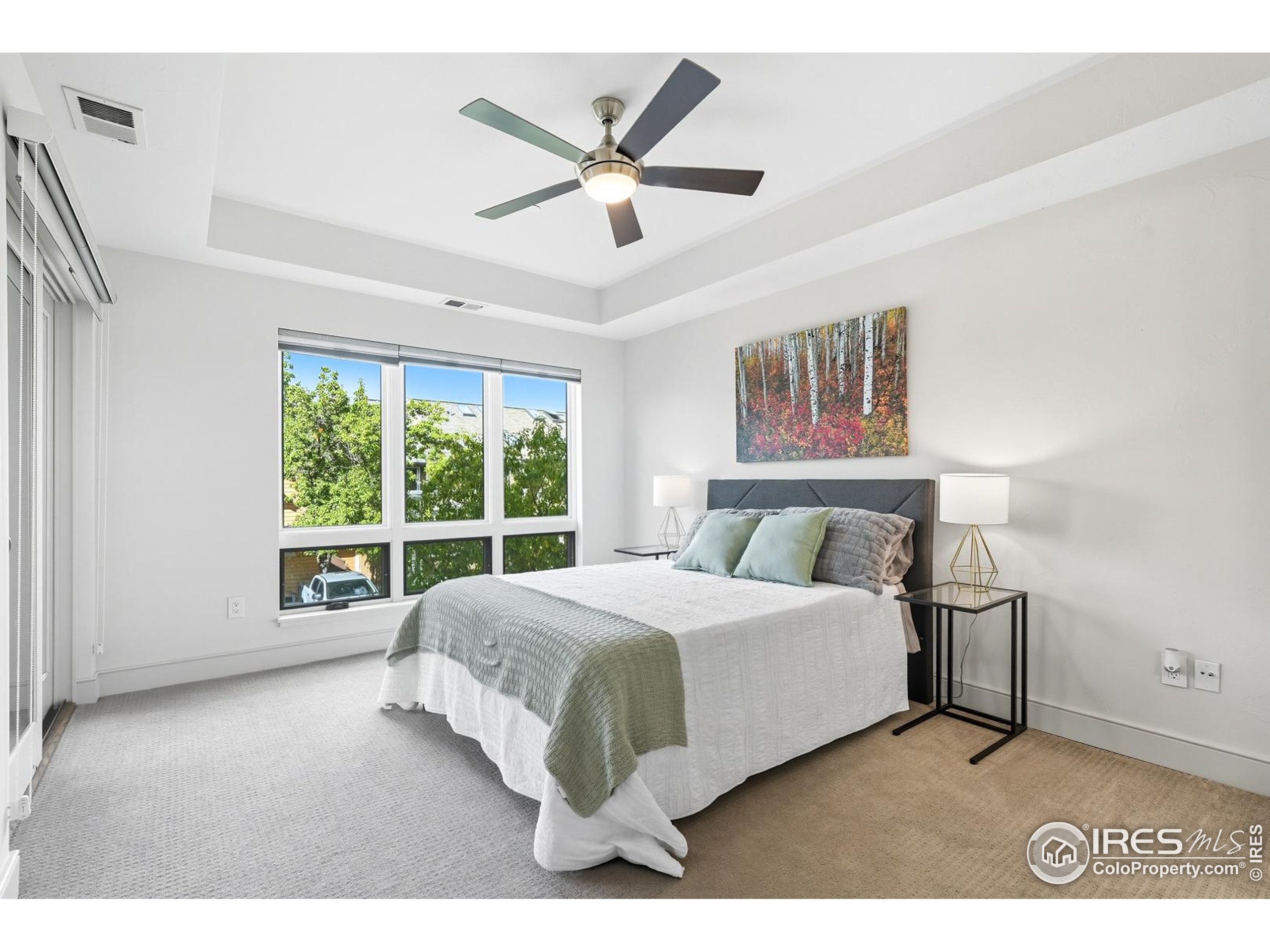 2801 Pennsylvania Avenue, Unit 203 Boulder, CO 80303 - Photo 21 of 50 a bedroom with a large bed and a large window