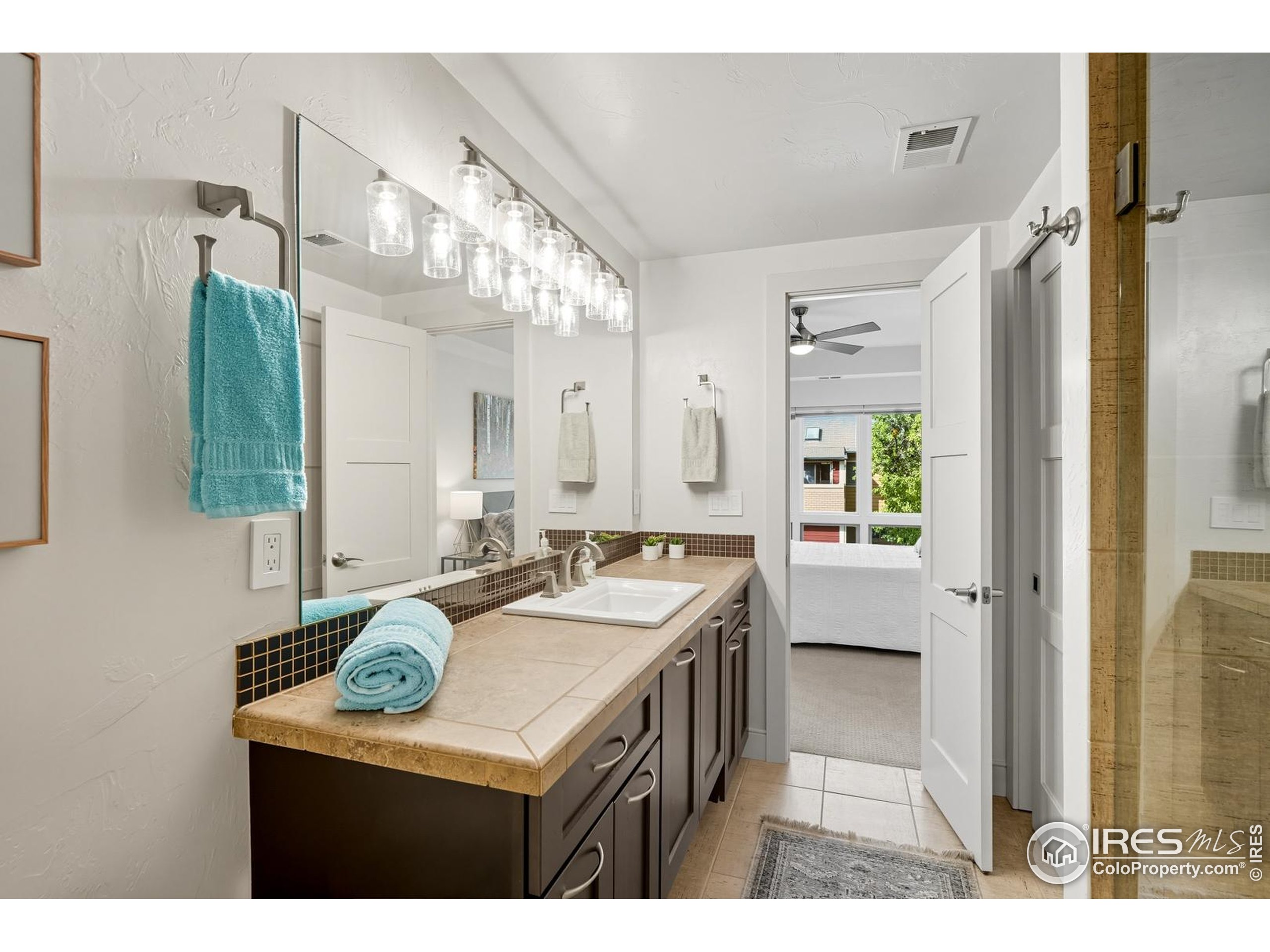 2801 Pennsylvania Avenue, Unit 203 Boulder, CO 80303 - Photo 22 of 50 a bathroom with a sink a vanity and a mirror