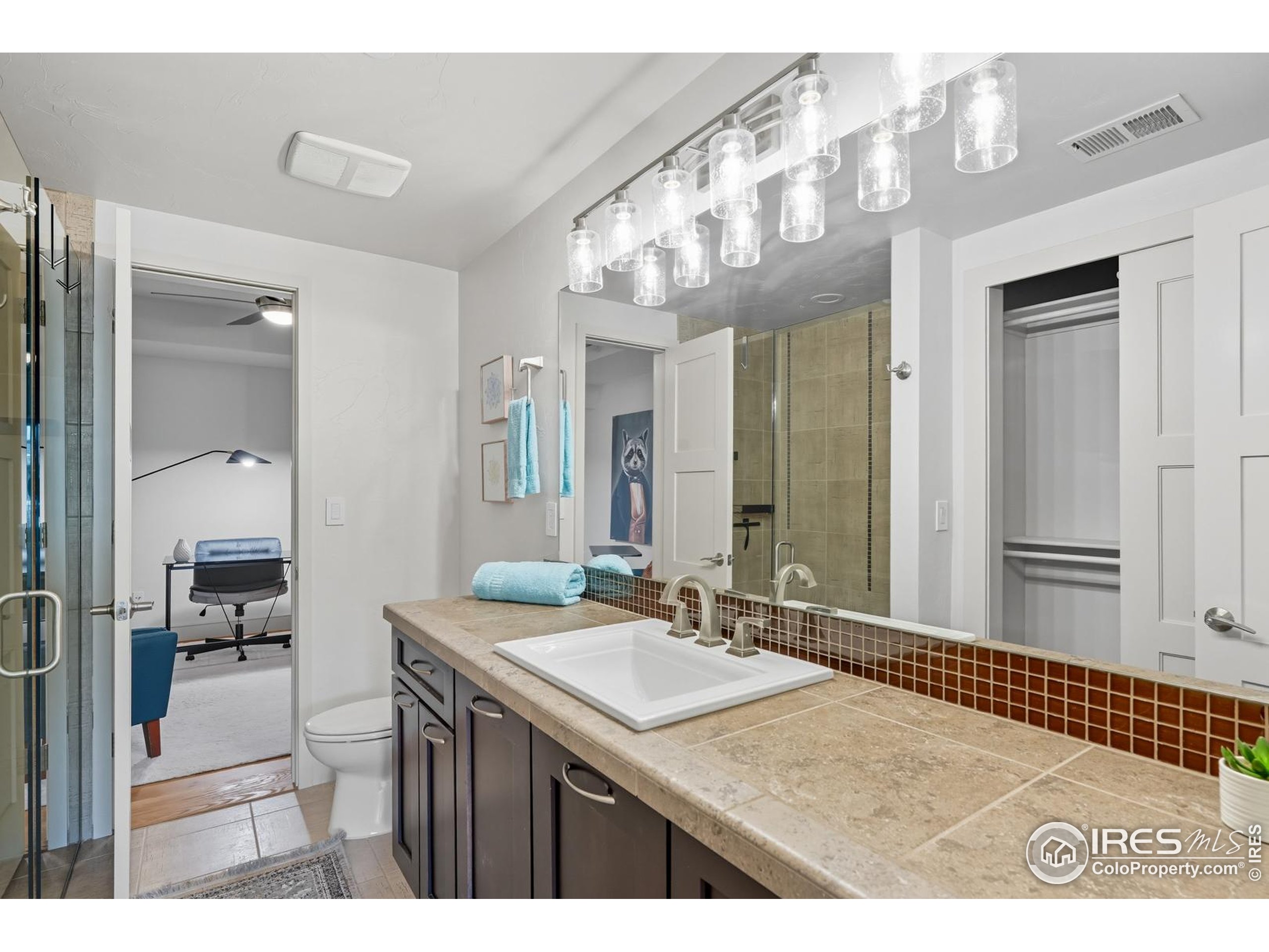 2801 Pennsylvania Avenue, Unit 203 Boulder, CO 80303 - Photo 23 of 50 a bathroom with a sink a mirror and a shower