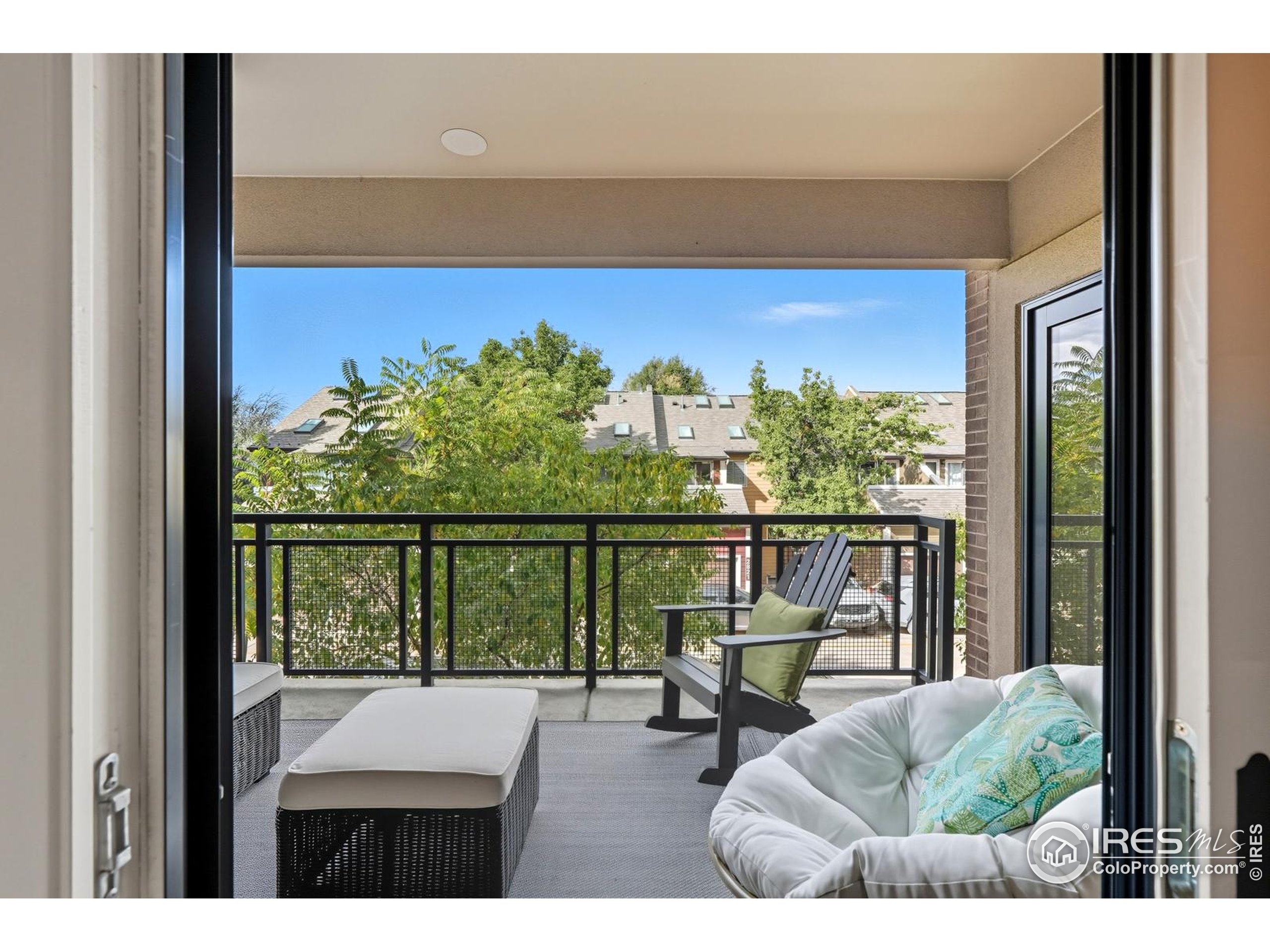 2801 Pennsylvania Avenue, Unit 203 Boulder, CO 80303 - Photo 24 of 50 a view of a balcony with chairs and a table