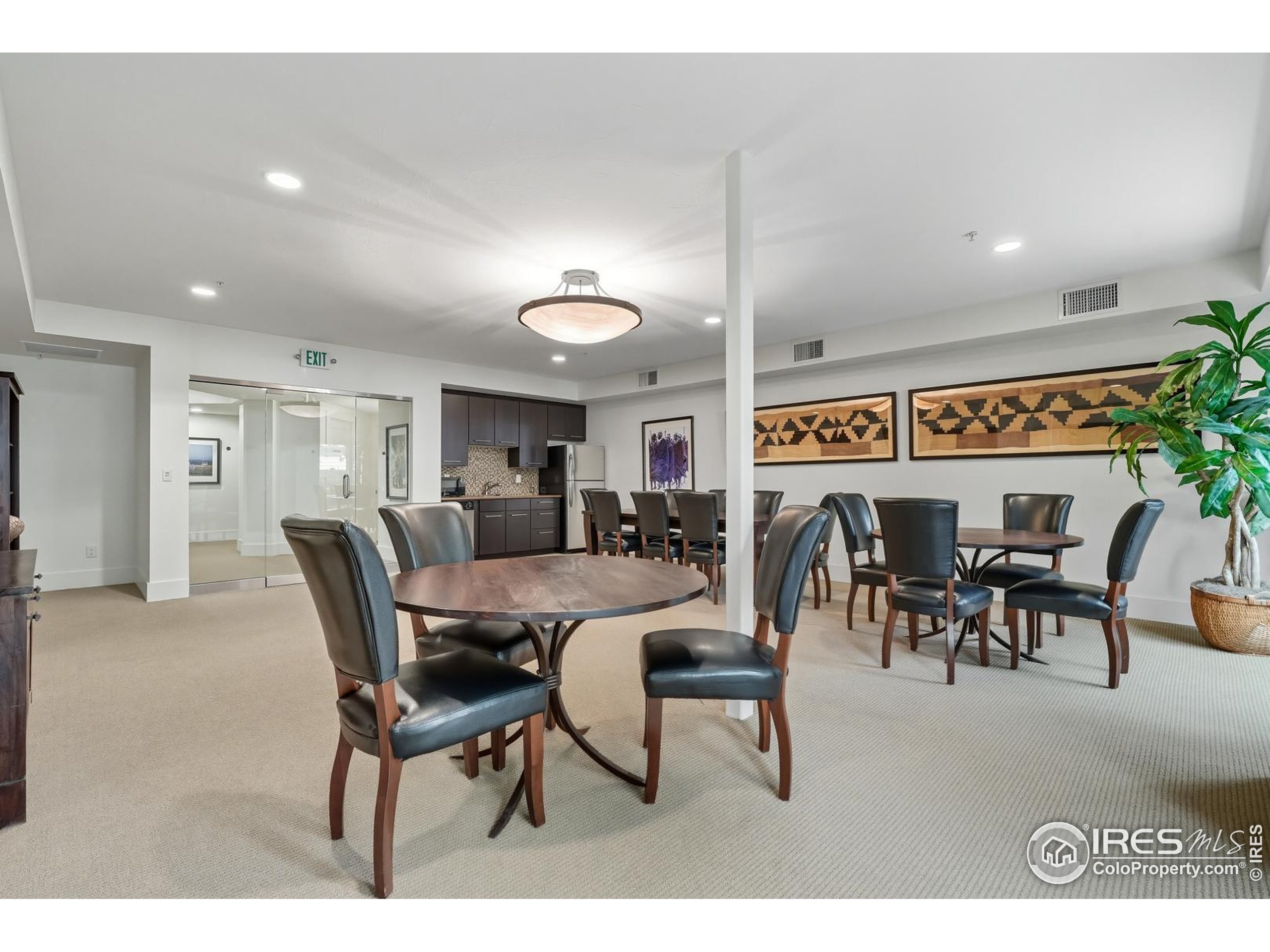 2801 Pennsylvania Avenue, Unit 203 Boulder, CO 80303 - Photo 30 of 50 a living room with lots of furniture a dining table and a potted plant