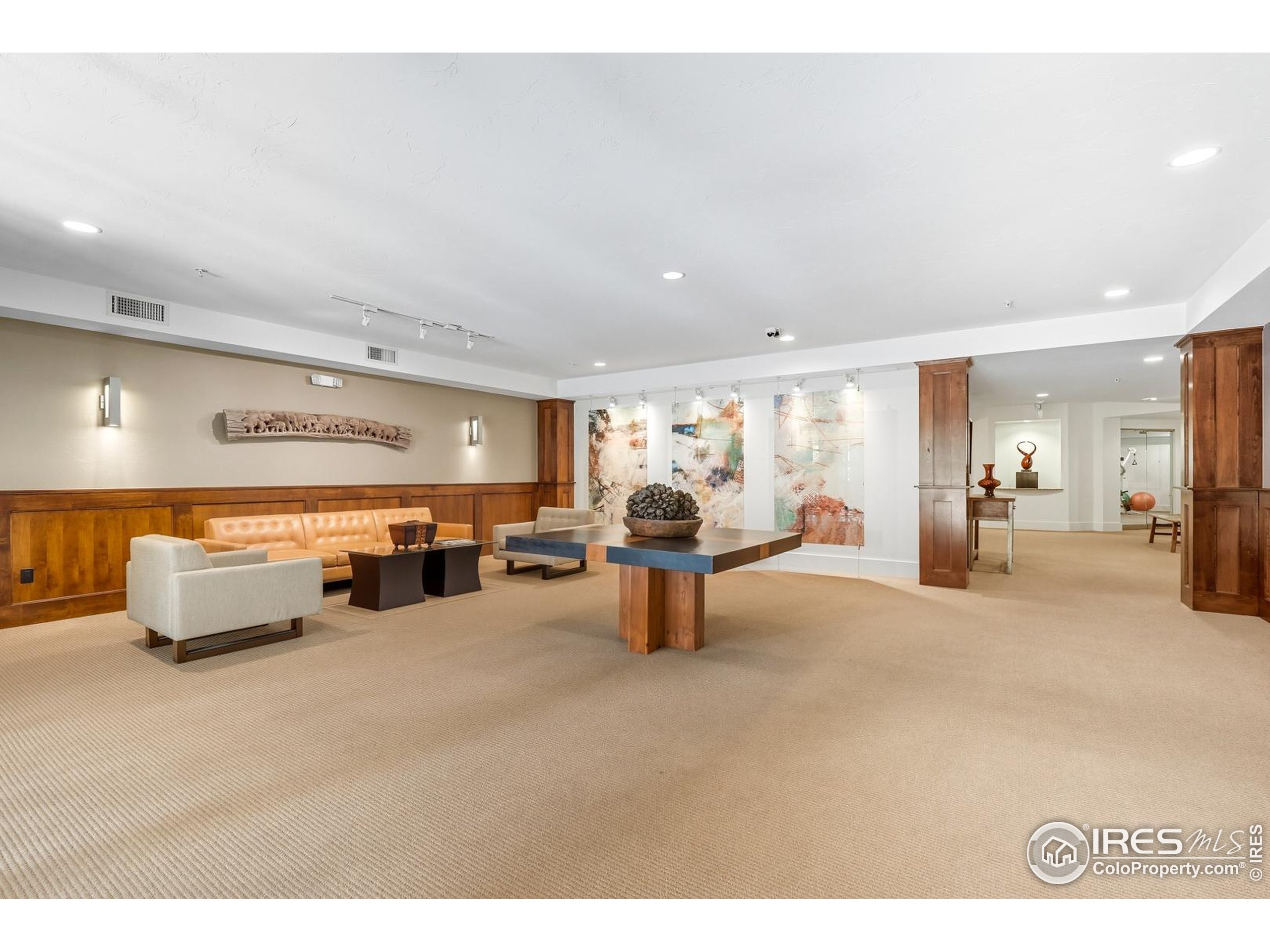 2801 Pennsylvania Avenue, Unit 203 Boulder, CO 80303 - Photo 33 of 50 a room with lots of furniture and a large window