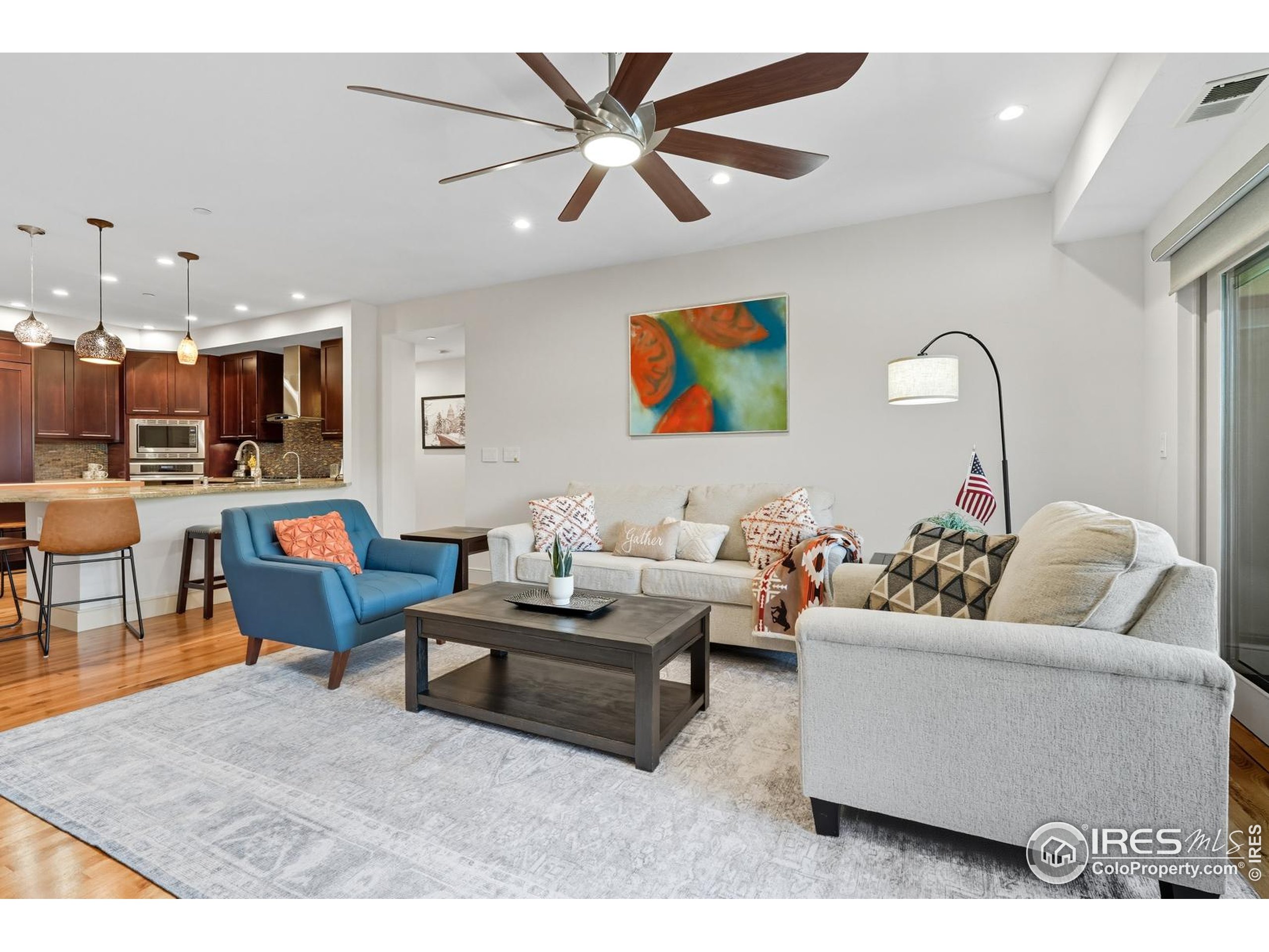 2801 Pennsylvania Avenue, Unit 203 Boulder, CO 80303 - Photo 5 of 50 a living room with furniture kitchen view and a chandelier