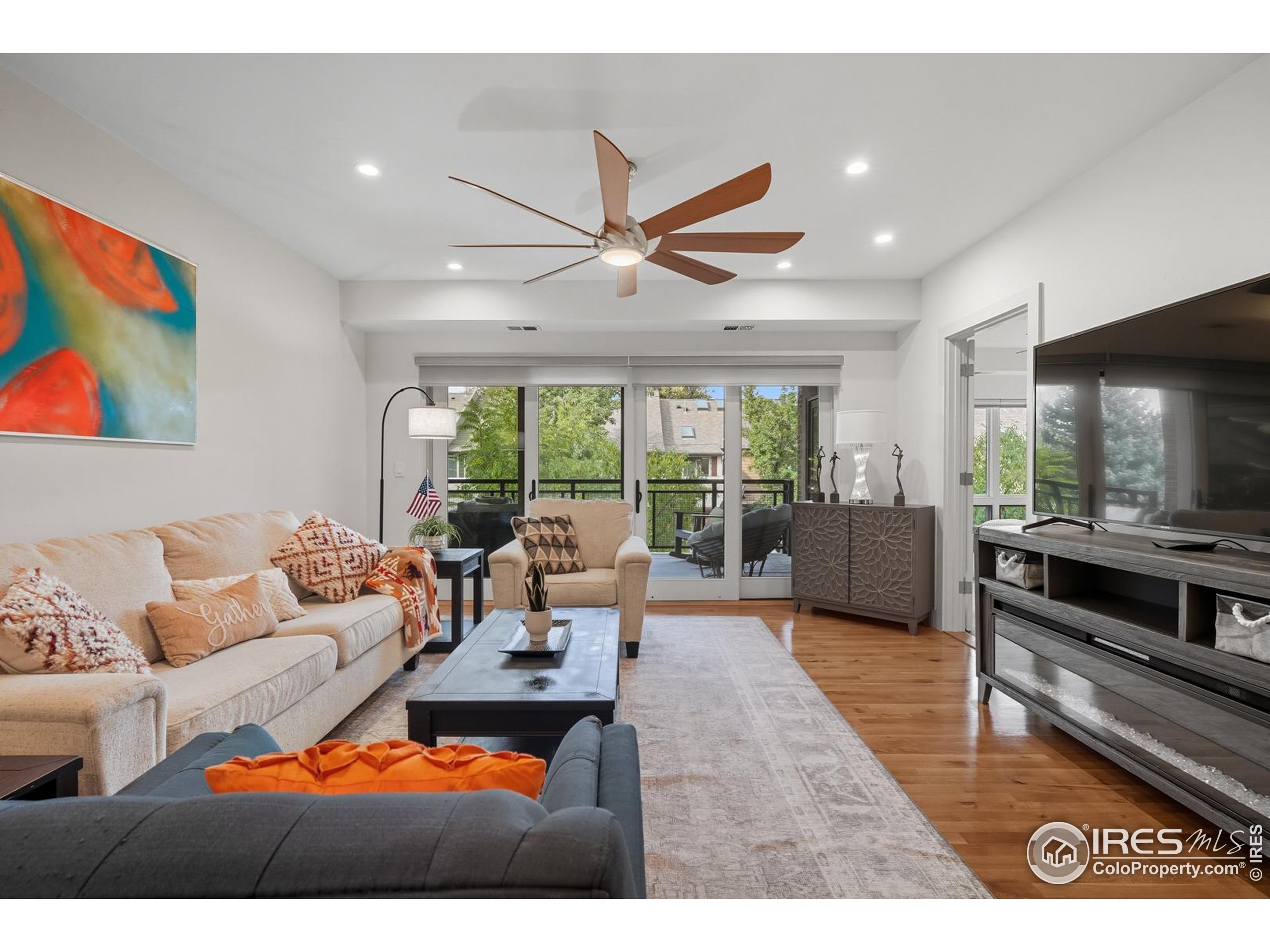 2801 Pennsylvania Avenue, Unit 203 Boulder, CO 80303 - Photo 7 of 50 a living room with furniture and a flat screen tv