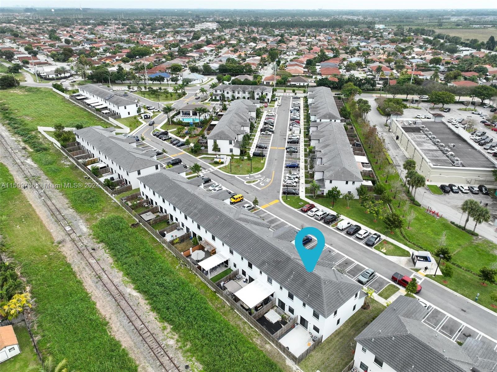18180 Southwest 148th Road, Unit 18180 Miami, FL 33187 - Photo 19 of 29 an aerial view of a city with lots of residential buildings