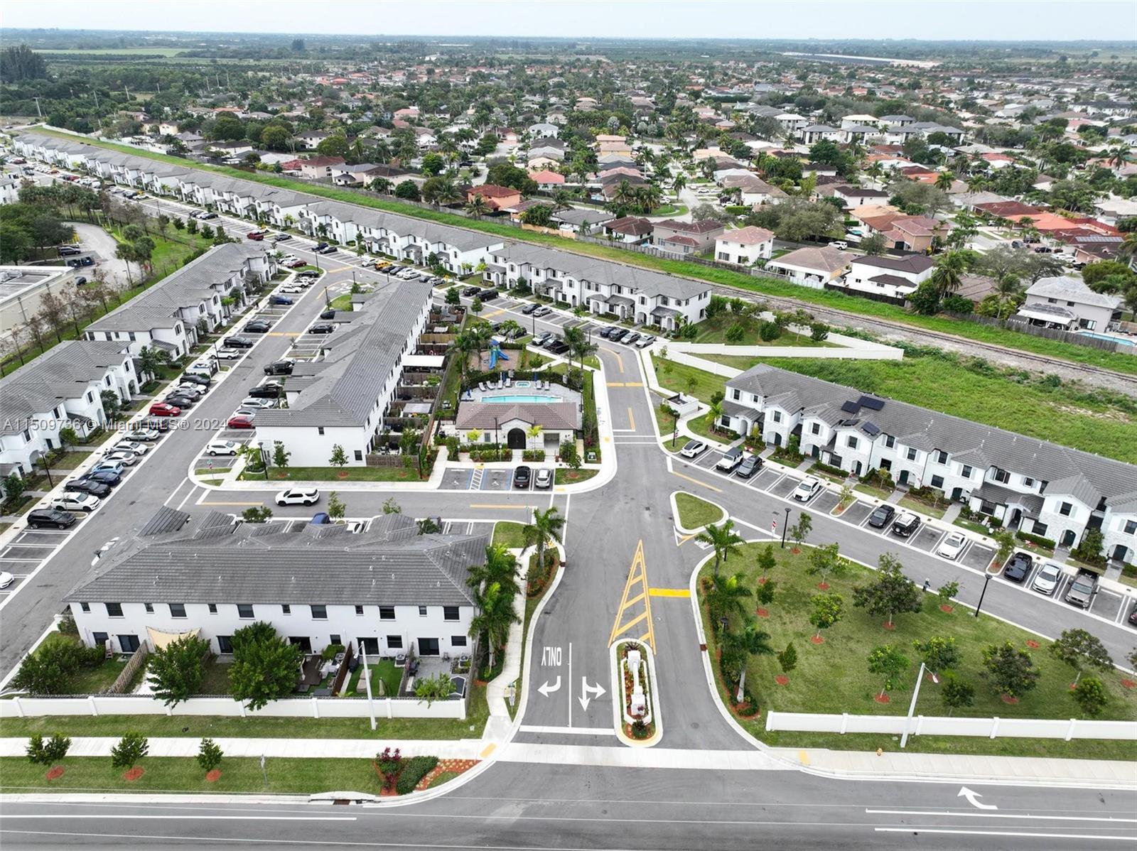 18180 Southwest 148th Road, Unit 18180 Miami, FL 33187 - Photo 20 of 29 an aerial view of a city with lots of buildings