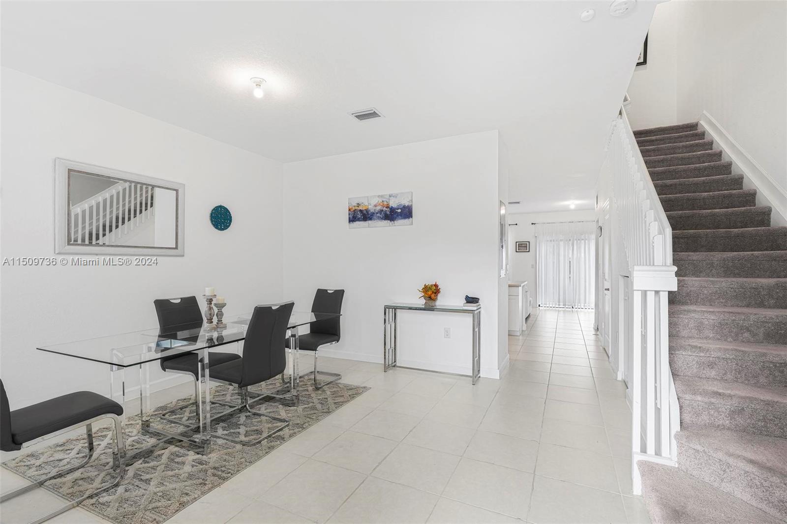 18180 Southwest 148th Road, Unit 18180 Miami, FL 33187 - Photo 2 of 29 a living room with furniture and wooden floor