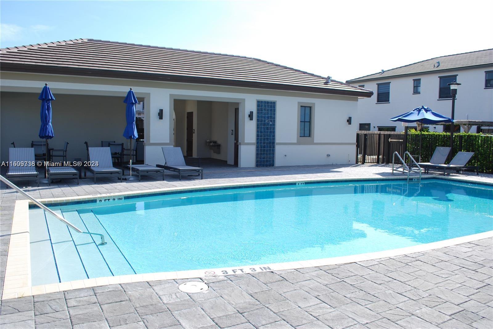 18180 Southwest 148th Road, Unit 18180 Miami, FL 33187 - Photo 25 of 29 a view of a house with swimming pool and sitting area