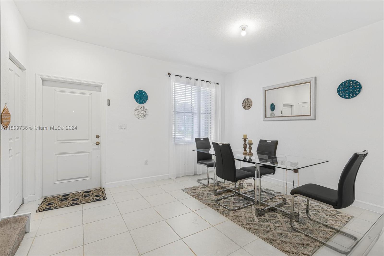 18180 Southwest 148th Road, Unit 18180 Miami, FL 33187 - Photo 4 of 29 a view of a livingroom with furniture and windows