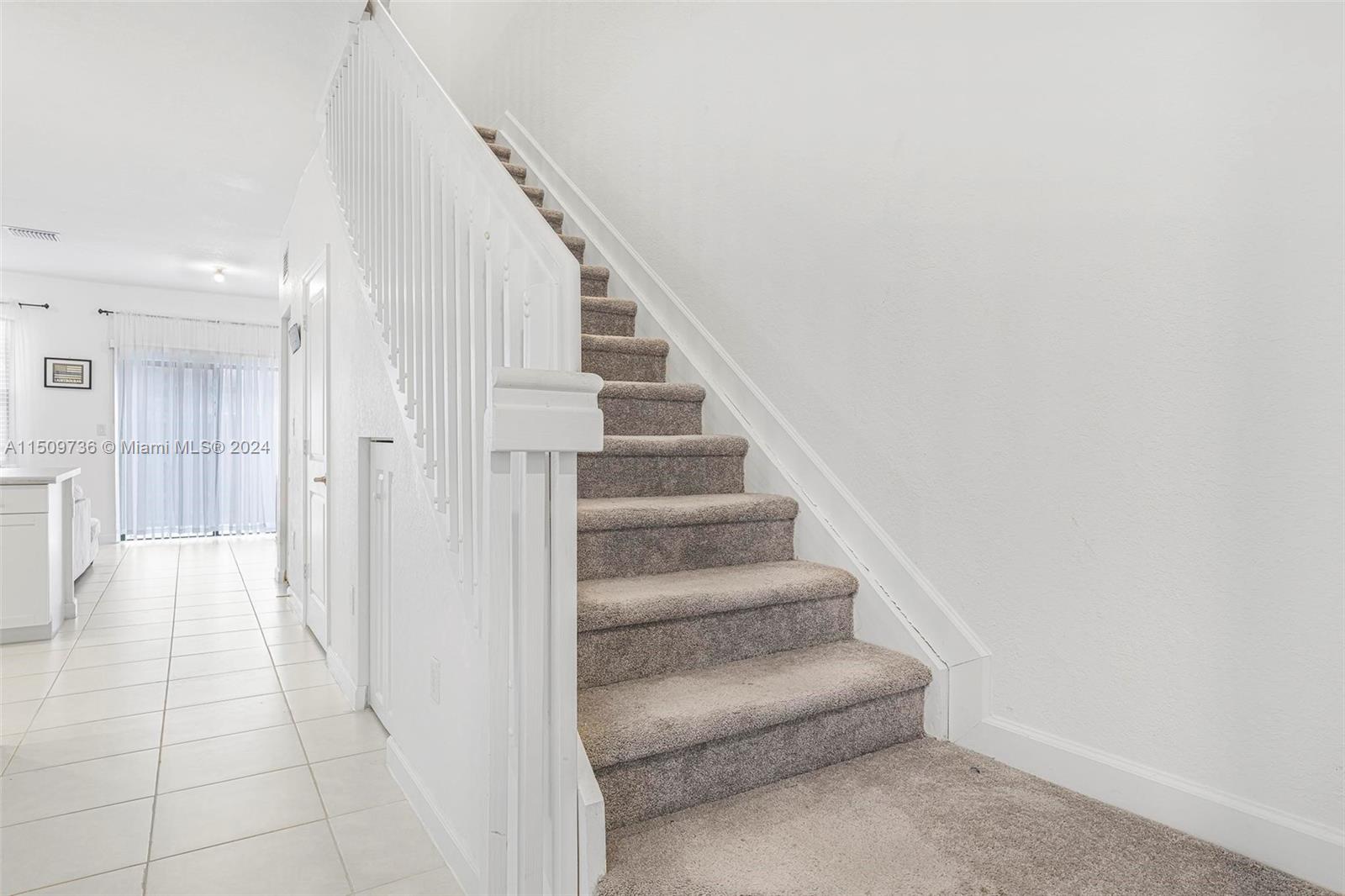 18180 Southwest 148th Road, Unit 18180 Miami, FL 33187 - Photo 9 of 29 a view of entryway with white walls