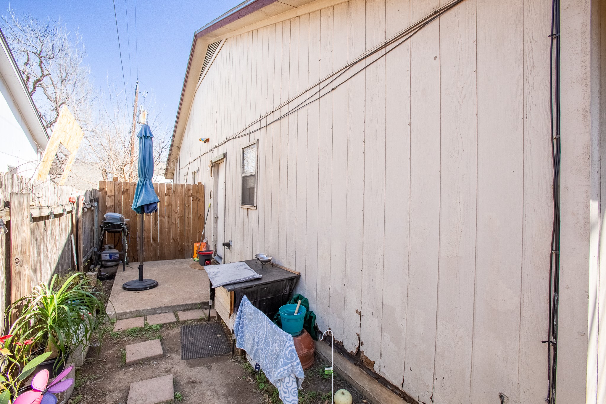 606 Misty Morning Way, Unit A AND B Round Rock, TX 78664 - Photo 20 of 22 View of side of home featuring a patio