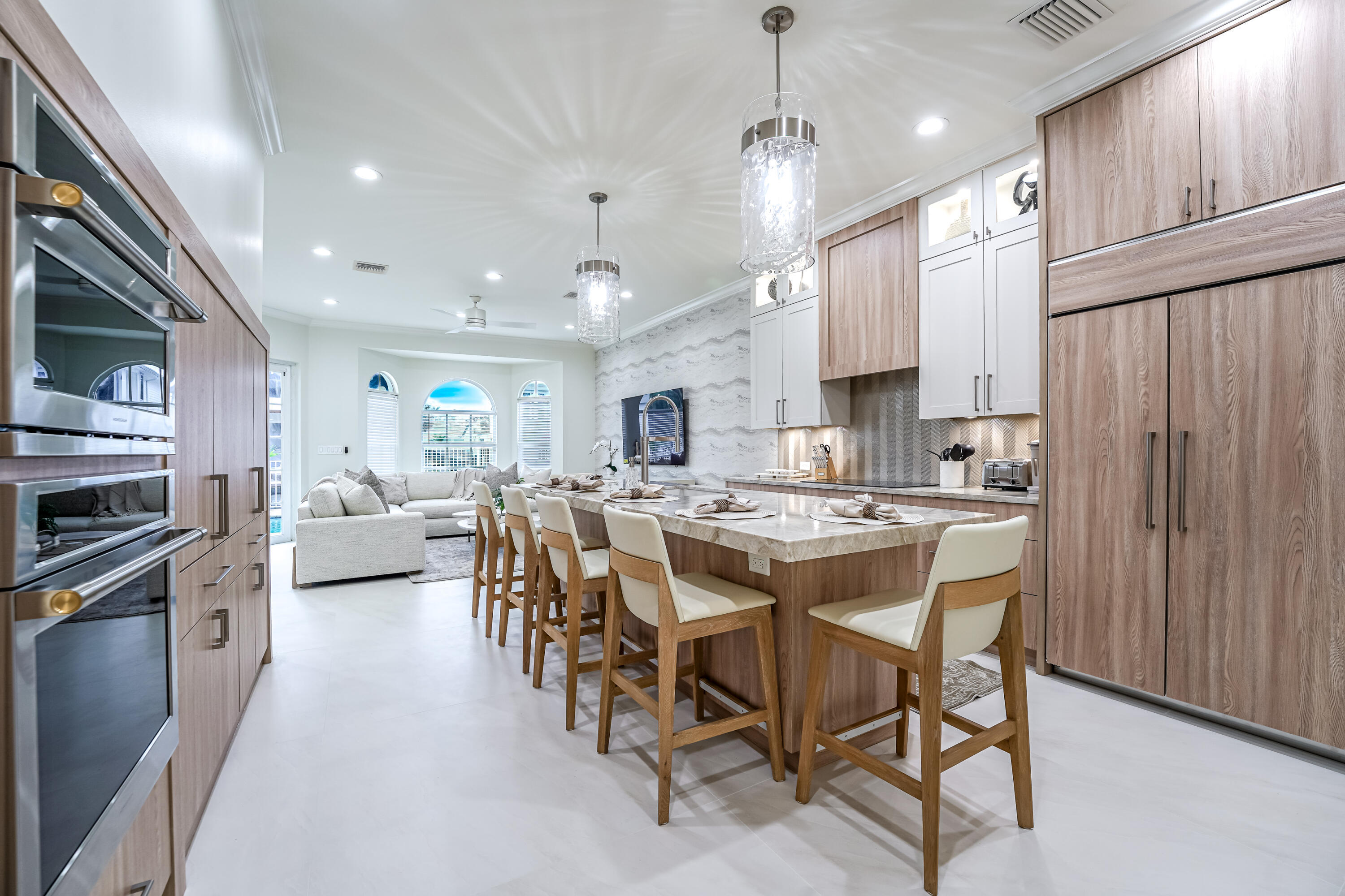 749 Northeast 71st Street Boca Raton, FL 33487 - Photo 15 of 43 a large kitchen with a table and chairs