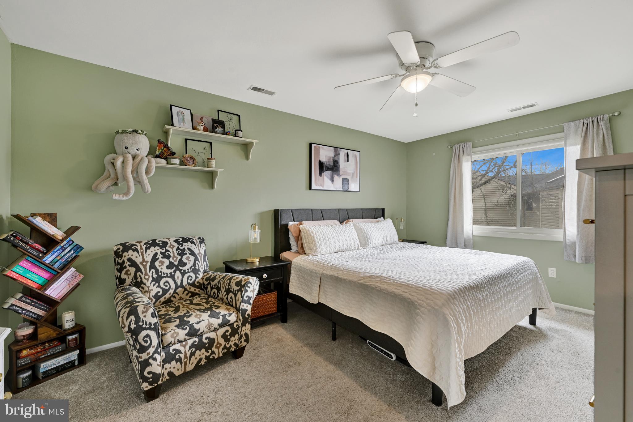 5 Mariners Way, Unit 2 Stevensville, MD 21666 - Photo 12 of 23 Serene bedroom with soft green hues.