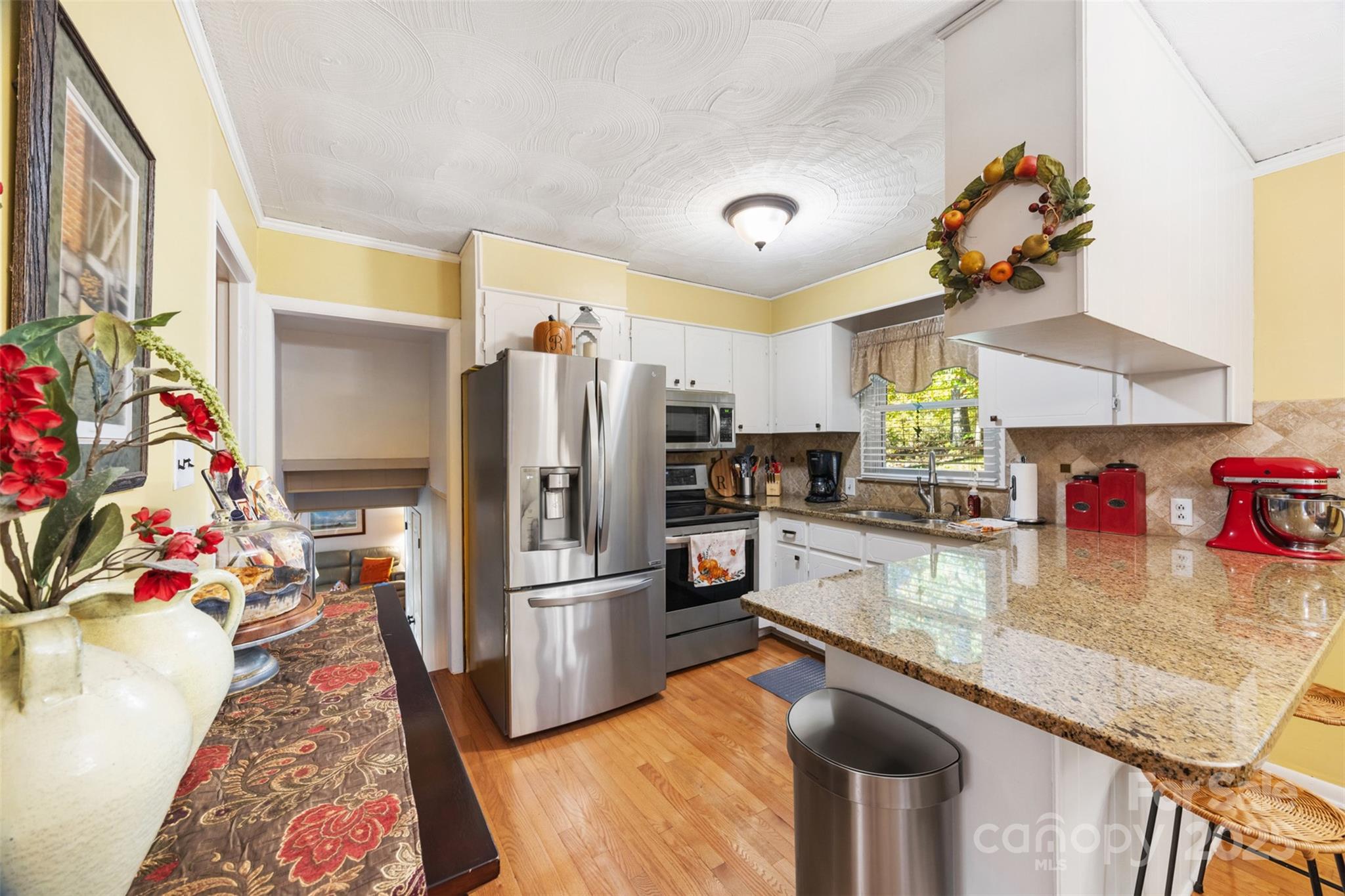 1711 McCombs Street Newton, NC 28658 - Photo 11 of 41 a kitchen with refrigerator and window