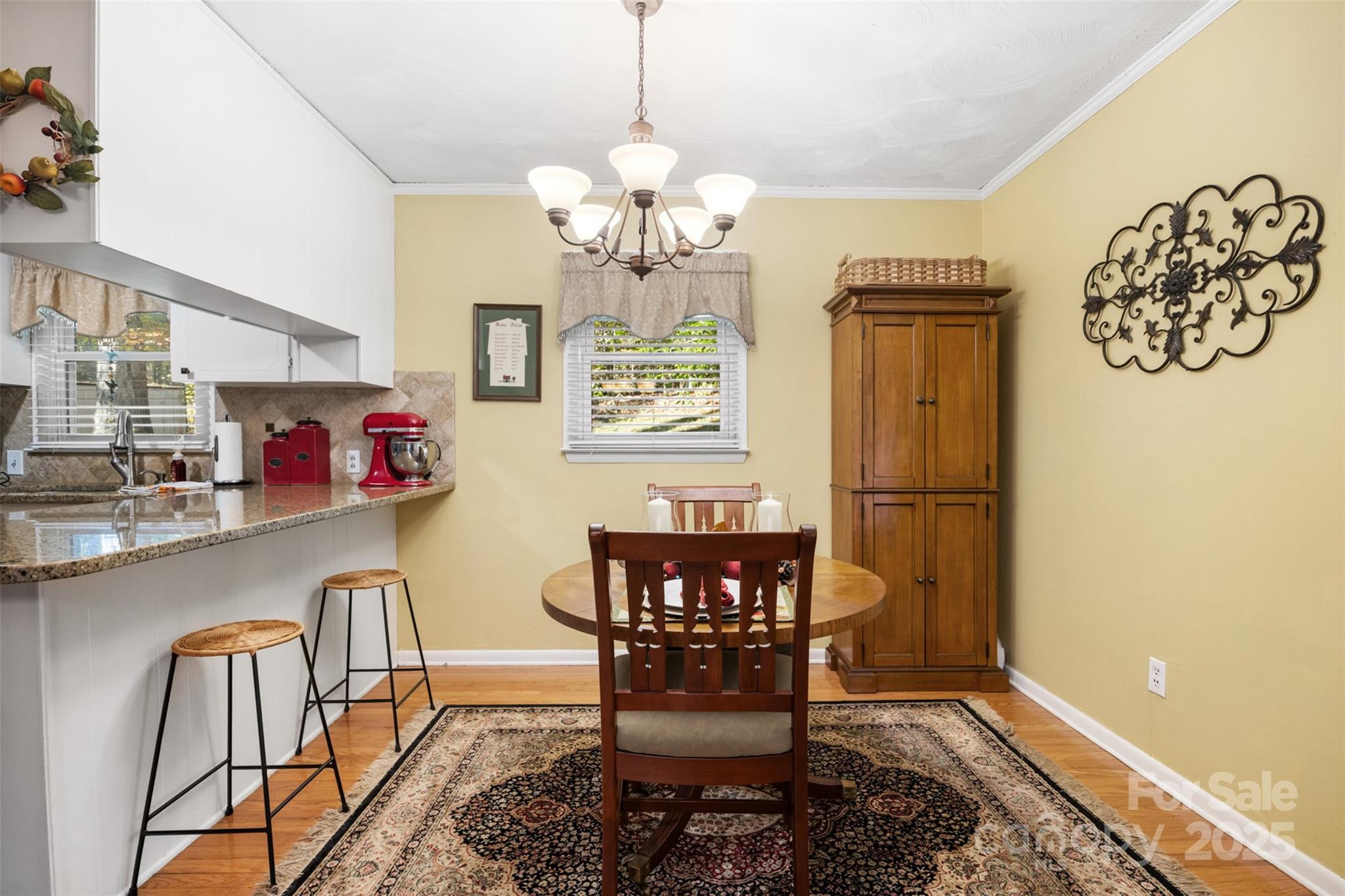 1711 McCombs Street Newton, NC 28658 - Photo 14 of 41 a view of a dining room with furniture and chandelier