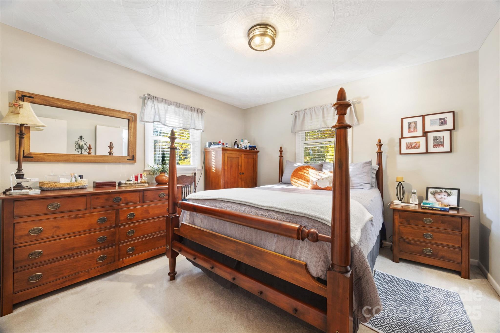 1711 McCombs Street Newton, NC 28658 - Photo 16 of 41 a bedroom with a bed and a dresser in it