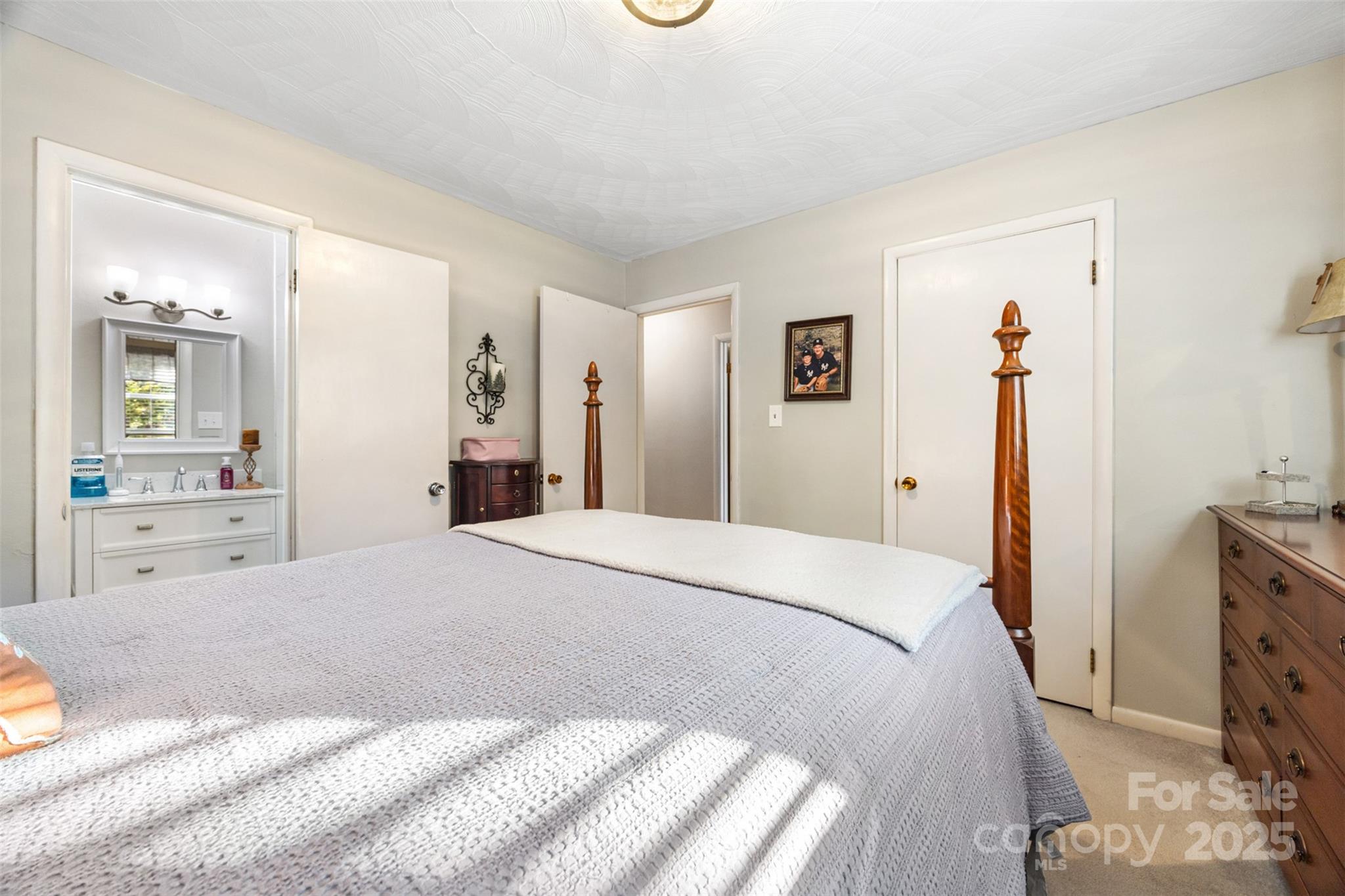 1711 McCombs Street Newton, NC 28658 - Photo 18 of 41 a spacious bedroom with a bed and a cabinets