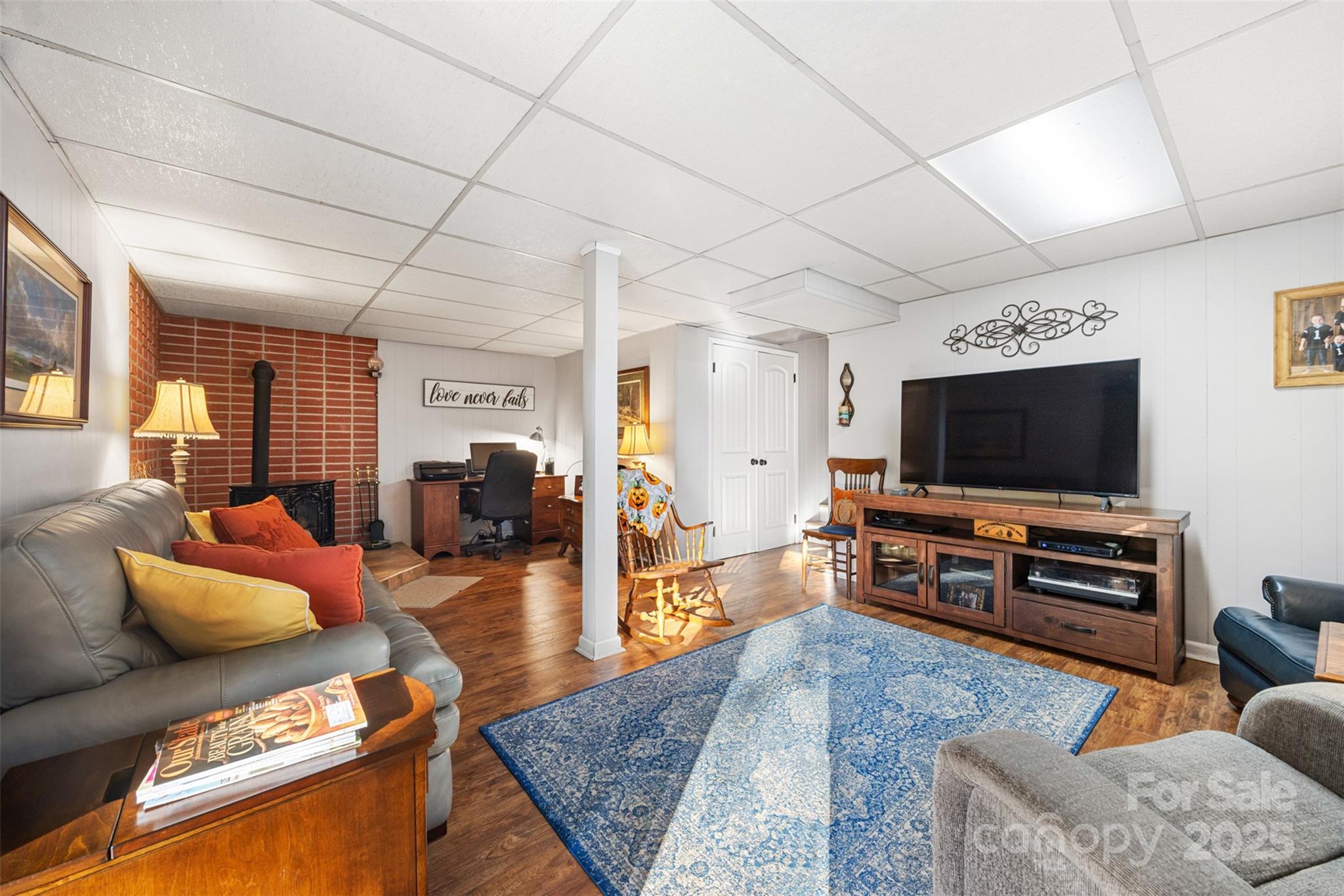 1711 McCombs Street Newton, NC 28658 - Photo 29 of 41 a living room with furniture and a flat screen tv