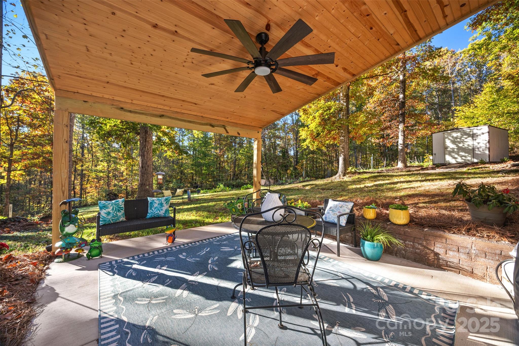1711 McCombs Street Newton, NC 28658 - Photo 31 of 41 a view of a patio with a table and chairs under an umbrella