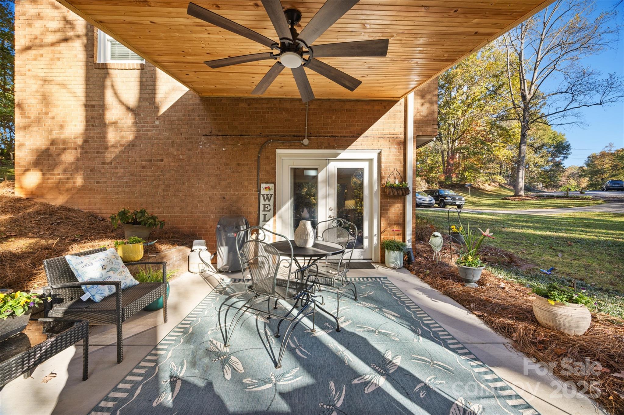 1711 McCombs Street Newton, NC 28658 - Photo 32 of 41 a view of a patio with table and chairs and potted plants
