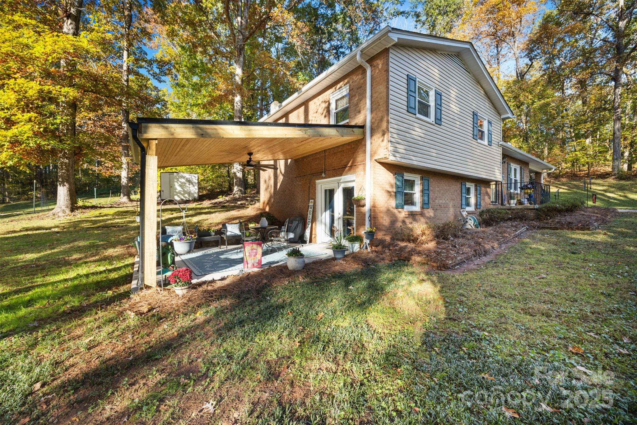 1711 McCombs Street Newton, NC 28658 - Photo 33 of 41 a view of a house with a yard patio and fire pit