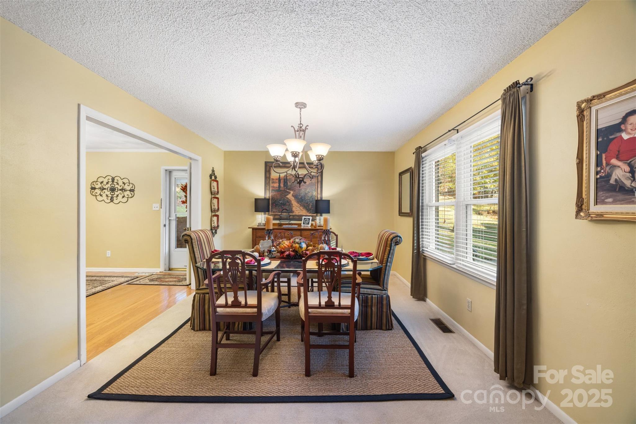 1711 McCombs Street Newton, NC 28658 - Photo 9 of 41 a view of a dining room with furniture window and wooden floor