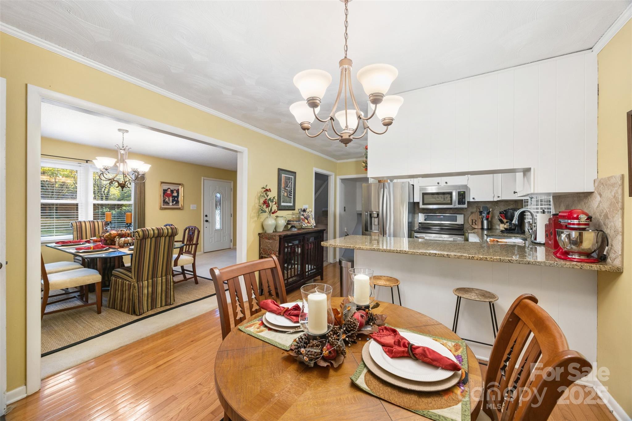 1711 McCombs Street Newton, NC 28658 - Photo 10 of 41 a view of a dining room with furniture and wooden floor