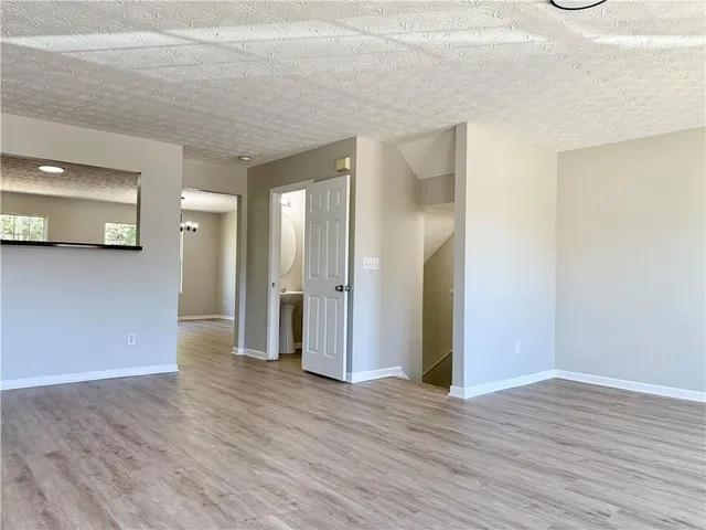 a view of a livingroom with wooden floor