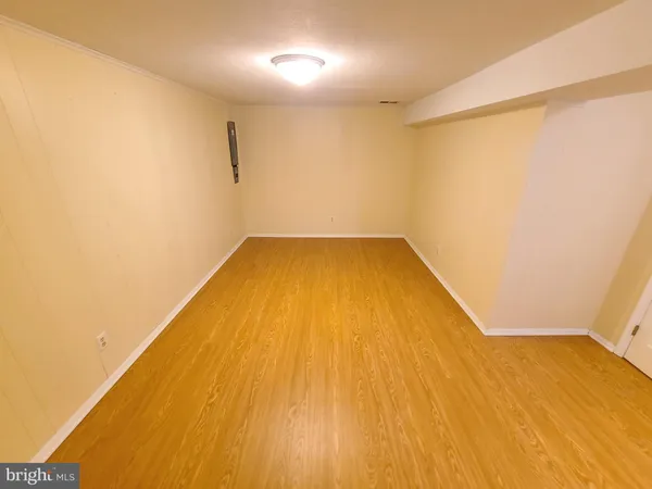 a view of a big room with wooden floor