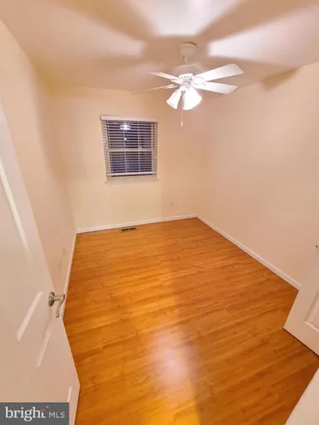 a view of a room with a wooden floor