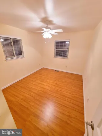 a view of an empty room with windows