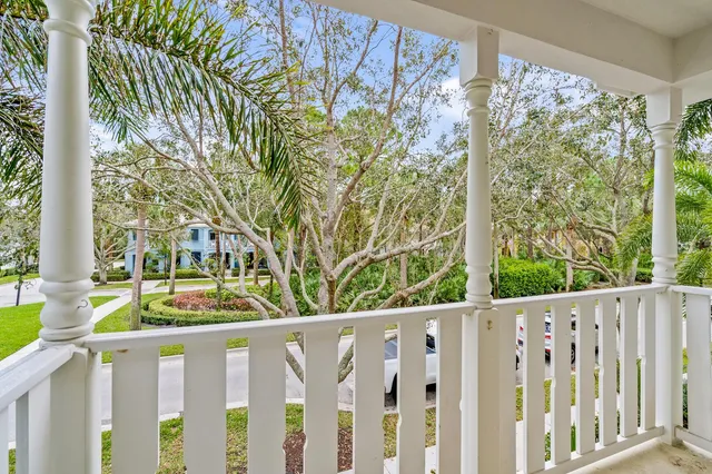 a wooden fence with trees in the background