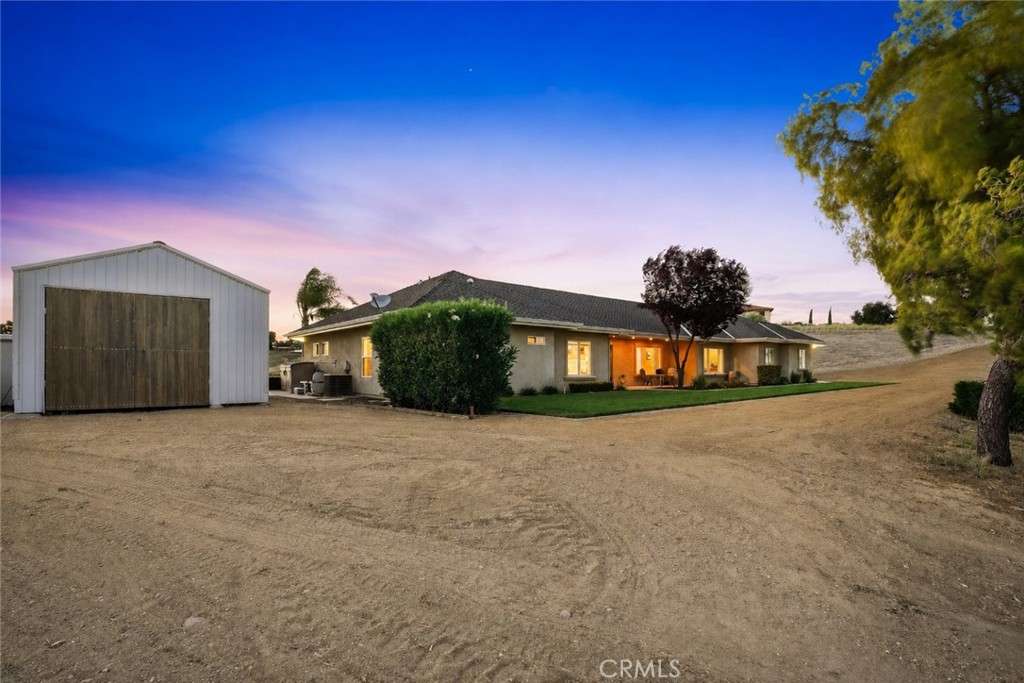 220 Cook Court Templeton, CA 93465 - Photo 5 of 45 a front view of a house with a yard and garage