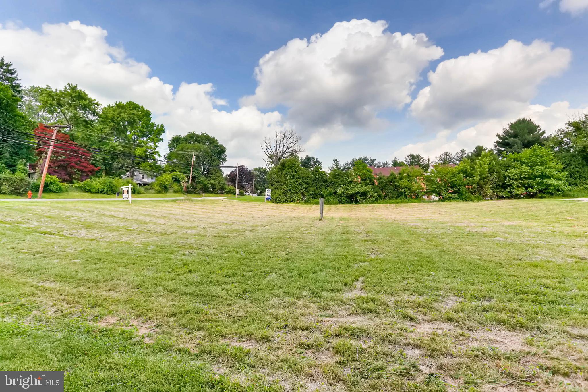 Warren Road Hunt Valley, MD 21030 - Photo 3 of 11 a view of a field with an trees in the background
